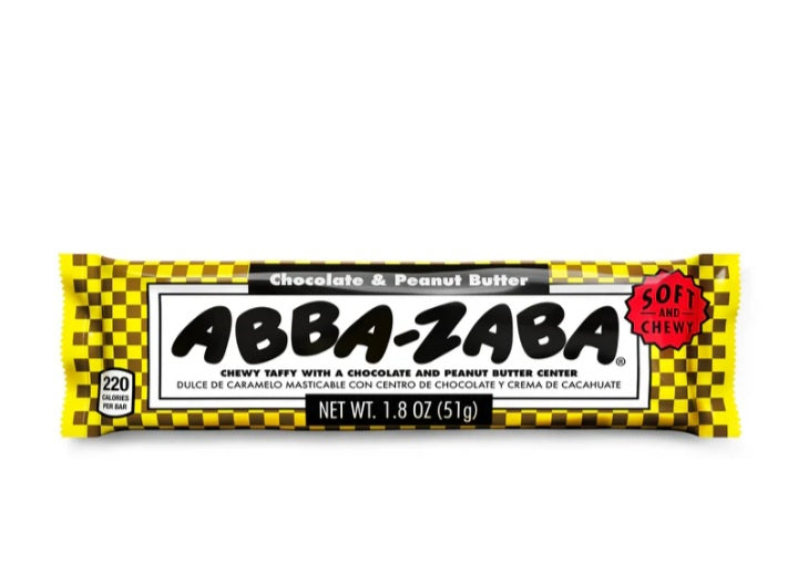 White taffy candy with black and yellow wrapper that says "Abba Zabba". This Abba Zabba has a peanut butter filling.